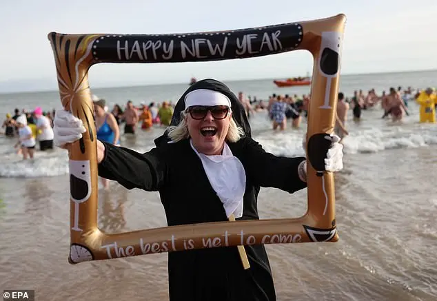 Over 200 swimmers participate in Whitley Bay's traditional New Year's Day dip to mark 2026