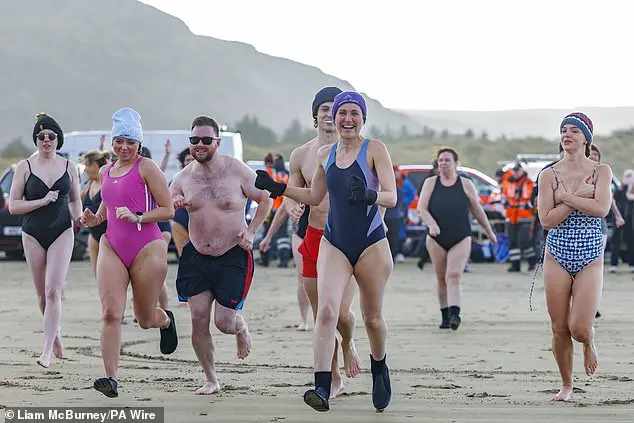 Over 200 swimmers participate in Whitley Bay's traditional New Year's Day dip to mark 2026