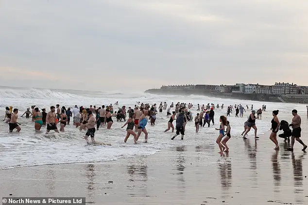 Over 200 swimmers participate in Whitley Bay's traditional New Year's Day dip to mark 2026