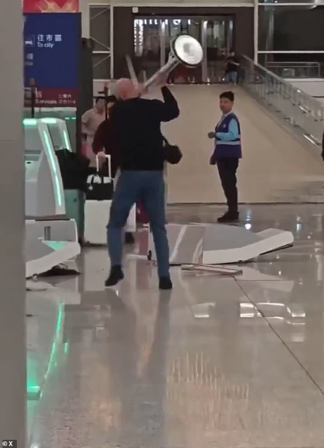 British Tourist Caught on Camera in Violent Outburst at Hong Kong Airport, Smashing Kiosks with Metal Pole