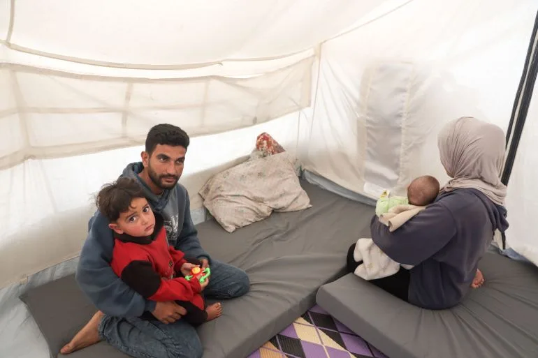 Gazans rely on phone torches for light as war destroys power grid.