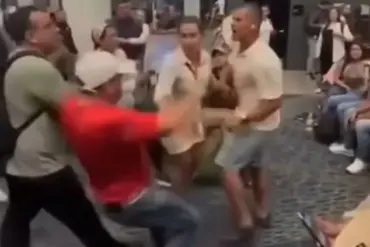 ''This is not acceptable:'' Claudia Segura, a government contractor, denounces the assault at El Dorado Airport as Héctor Santacruz faces arrest over the incident.